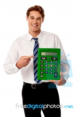 Corporate Man Showing Big Green Calculator Stock Photo