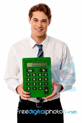 Corporate Man Showing Big Green Calculator Stock Photo