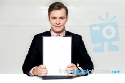 Corporate Man Showing Blank Clipboard Stock Photo