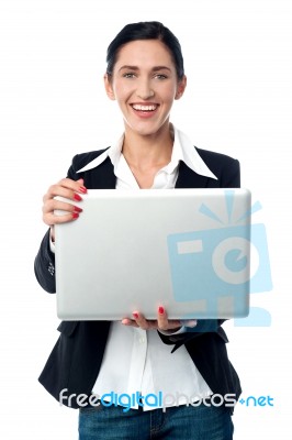 Corporate Woman Holding Laptop Stock Photo