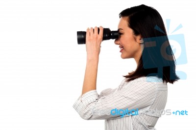 Corporate Woman Viewing Through Binoculars Stock Photo