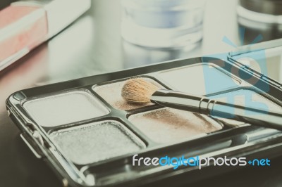 Cosmetics Brush And Palette And Lip Gloss And Eyeshadow Classic Stock Photo