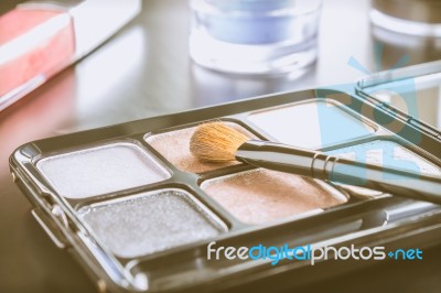 Cosmetics Brush And Palette And Lip Gloss And Eyeshadow Vintage Stock Photo