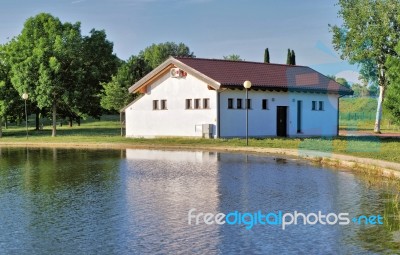 Country House Into The Nature In Front Of A Lake Stock Photo