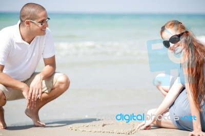 Couple At The Beach Stock Photo