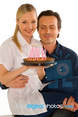 Couple Celebrating Birthday With Cake Stock Photo