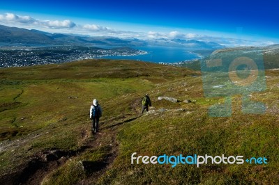 Couple Descending From Norway Mountain Background Stock Photo