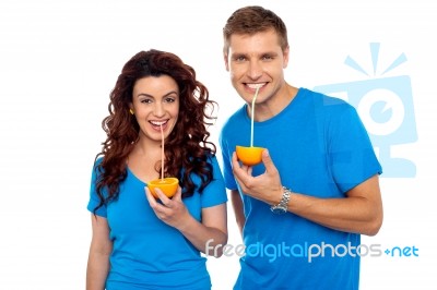 Couple Drinking Orange Juice Stock Photo