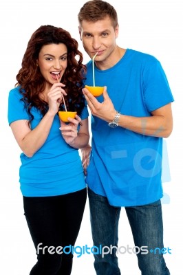 Couple Drinking Orange Juice Stock Photo