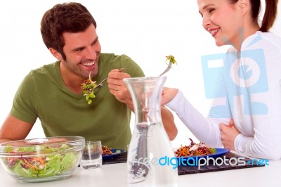 Couple Eating Veg Stock Photo