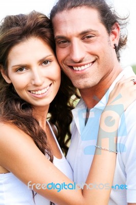 Couple Embracing And Smiling Stock Photo