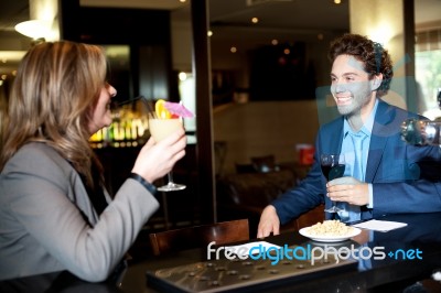 Couple Enjoying Cocktail At The Bar Stock Photo