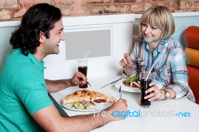 Couple Enjoying Dinner At A Restaurant Stock Photo