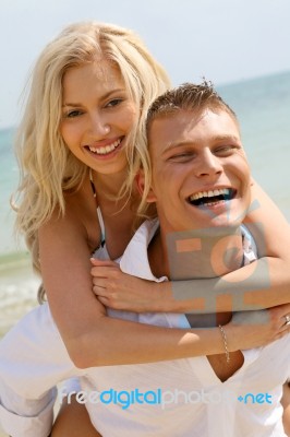 Couple enjoying Piggyback Ride Stock Photo