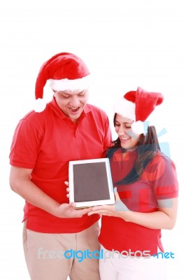 Couple Enjoying Their New Touchpad Stock Photo