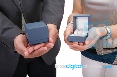 Couple Hands Holding Boxes With Rings. Valentines Day And Engage… Stock Photo