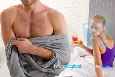 Couple Having Breakfast In Bed Stock Photo