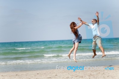 Couple Having Fun On Beach Stock Photo