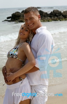 Couple Hugging At Beach Stock Photo