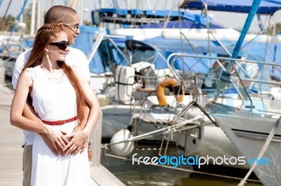 Couple Hugging At Harbour Stock Photo