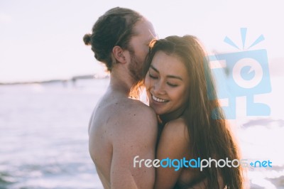 Couple Is Giving Each Other Hug At The Beach When Is Sunset Stock Photo