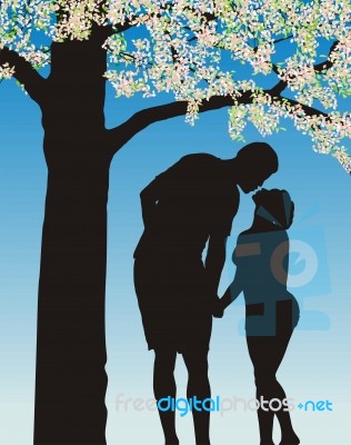 Couple Ksising Under Tree Stock Image