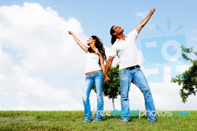 Couple Posing Under Sky Stock Photo