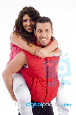 Couple Riding Piggy Back Stock Photo