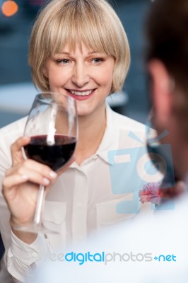 Couple Sipping Red Wine And Cherishing Memories Stock Photo