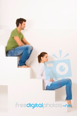 Couple Sitting On Stairs Stock Photo