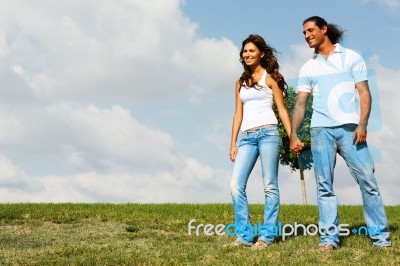 Couple Standing By Holding Hands Stock Photo