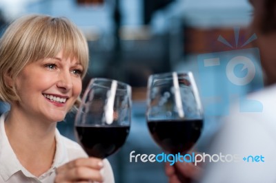 Couple Toasting In A Restaurant Stock Photo