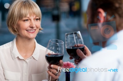 Couple Toasting Wine Glasses Stock Photo