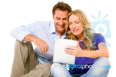 Couple Using Digital Tablet Stock Photo