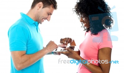 Couple Using Wireless Touch Pad Pc Stock Photo