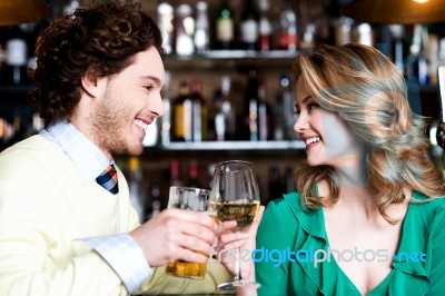 Couples Enjoying Drinks In Nightclub Stock Photo