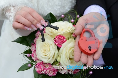 Couple's Hands Holding Wedding Lock Stock Photo