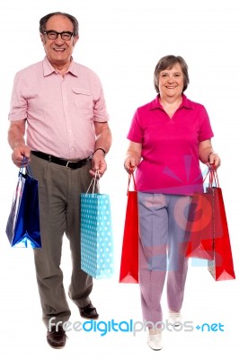 Couples Holding Shopping Bags Stock Photo