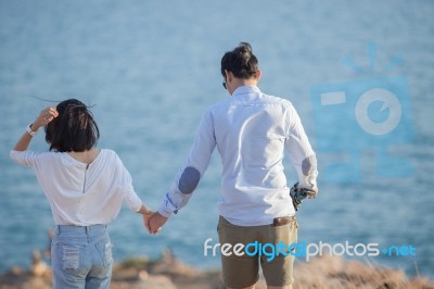 Couples Of Younger Man And Woman In Love Relaxing Vacation Outdoor Lifestyle Stock Photo