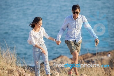 Couples Of Younger Man And Woman In Love Relaxing Vacation Outdoor Lifestyle Stock Photo