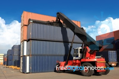 Crane Lifting Up Container In Railroad Yard Stock Photo