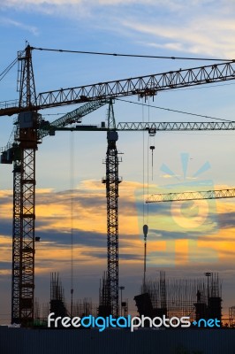 Crane Of Building Construction Against Beautiful Dusky Sky Stock Photo