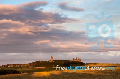 Craster, Northumberland/uk - August 20 : Sunset Over Dunstanburg… Stock Photo