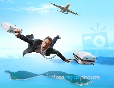 Crazy Business Man Flying From Passenger Plane With Briefcase An… Stock Photo