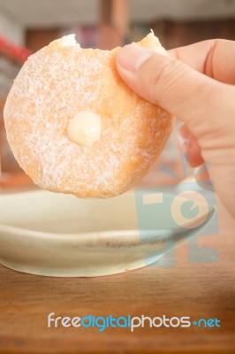 Cream Donut On Vintage Background Stock Photo