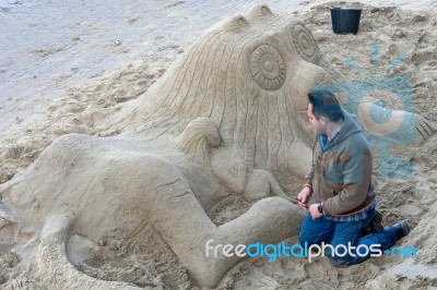 Creating A Sand Sculpture Stock Photo