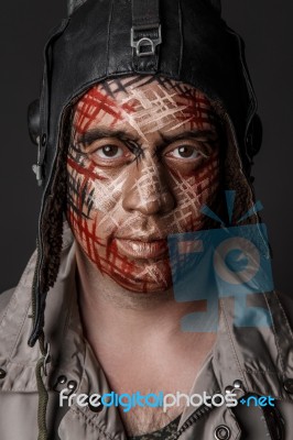 Creative And Funny Military Style Camouflage On Tankman Face Stock Photo