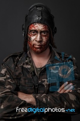 Creative And Funny Military Style Camouflage On Tankman Face Stock Photo