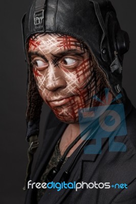 Creative And Funny Military Style Camouflage On Tankman Face Stock Photo