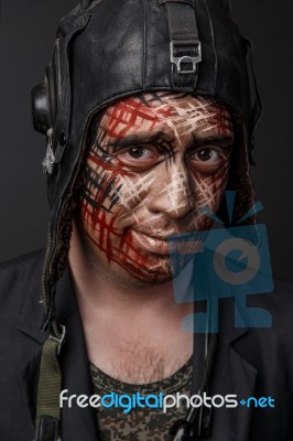 Creative And Funny Military Style Camouflage On Tankman Face Stock Photo